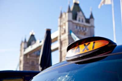 black-taxi-sign-in-front-of-the-tower-of-london